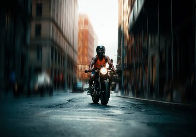 Biker riding up Spring street in SOHO