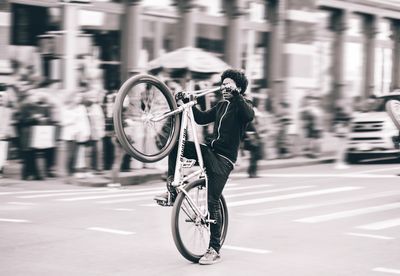Wheelie down Broadway ave in SOHO
