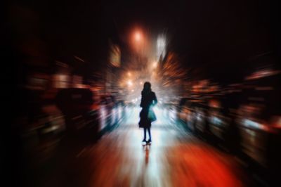 Nolita woman crossing the street at night